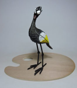 Bead and Wire Sculpture of a Crane - Handcrafted art piece showcasing a majestic black body, white wings, and yellow accents.