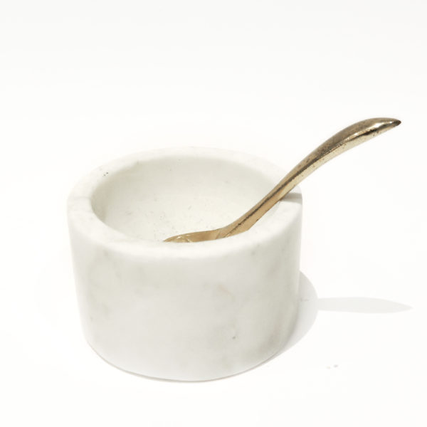 A white marble salt pot with a golden spoon, perfect for adding a touch of sophistication to your kitchen.