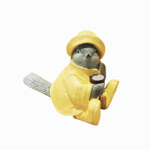 Ceramic dove figurine wearing a yellow raincoat, hat, and boots, adding charm and whimsy to any space.