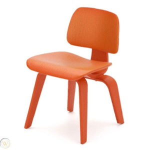 Miniature Eames LCW (Lounge Chair Wood) in Wood Copper, a timeless piece of furniture design.